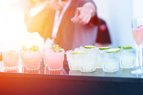 The Barbacks - Must visit cocktail events, a person holding a margarita at the Vibe conference