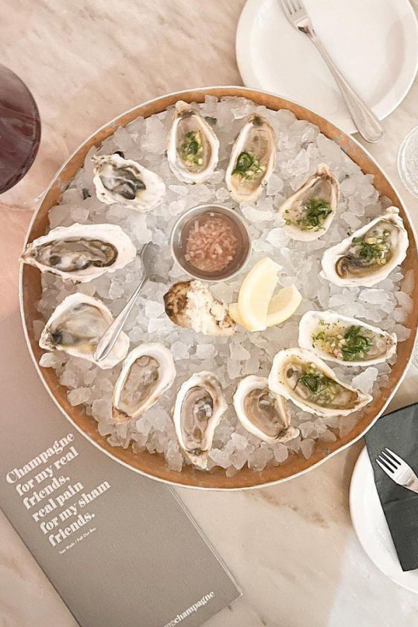 A plate of oysters at one of the best cocktail bars in Toronto